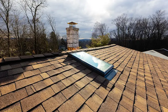 Close-up view of a residential roof with new shingles.